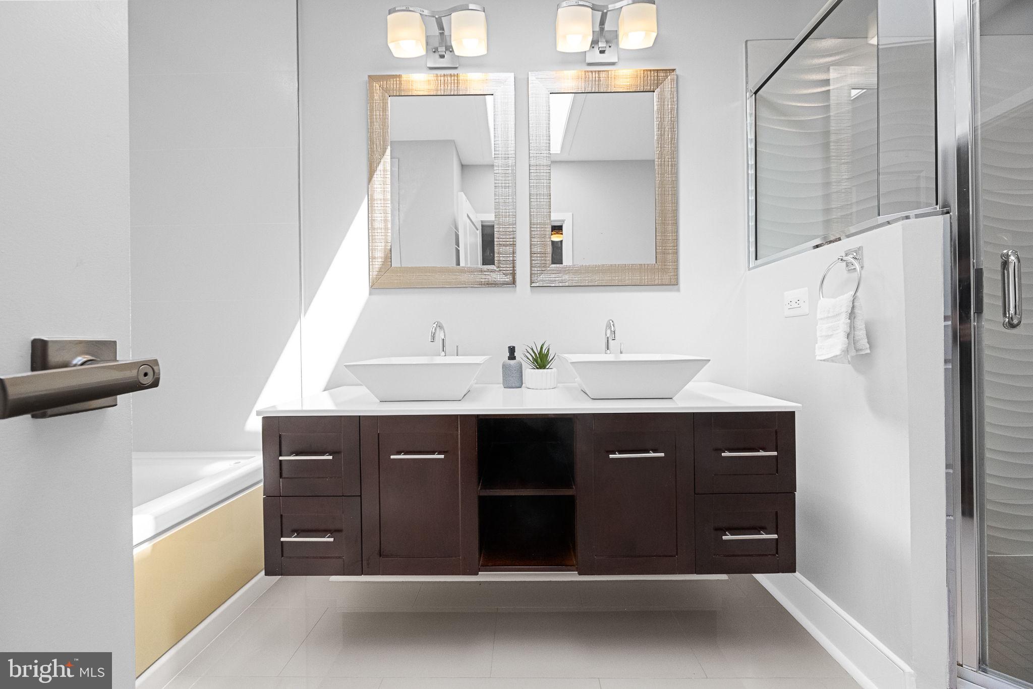 2819 11th Street Northwest, Unit 2 Washington, DC 20001 - Photo 28 of 36 a bathroom with a sink and a mirror