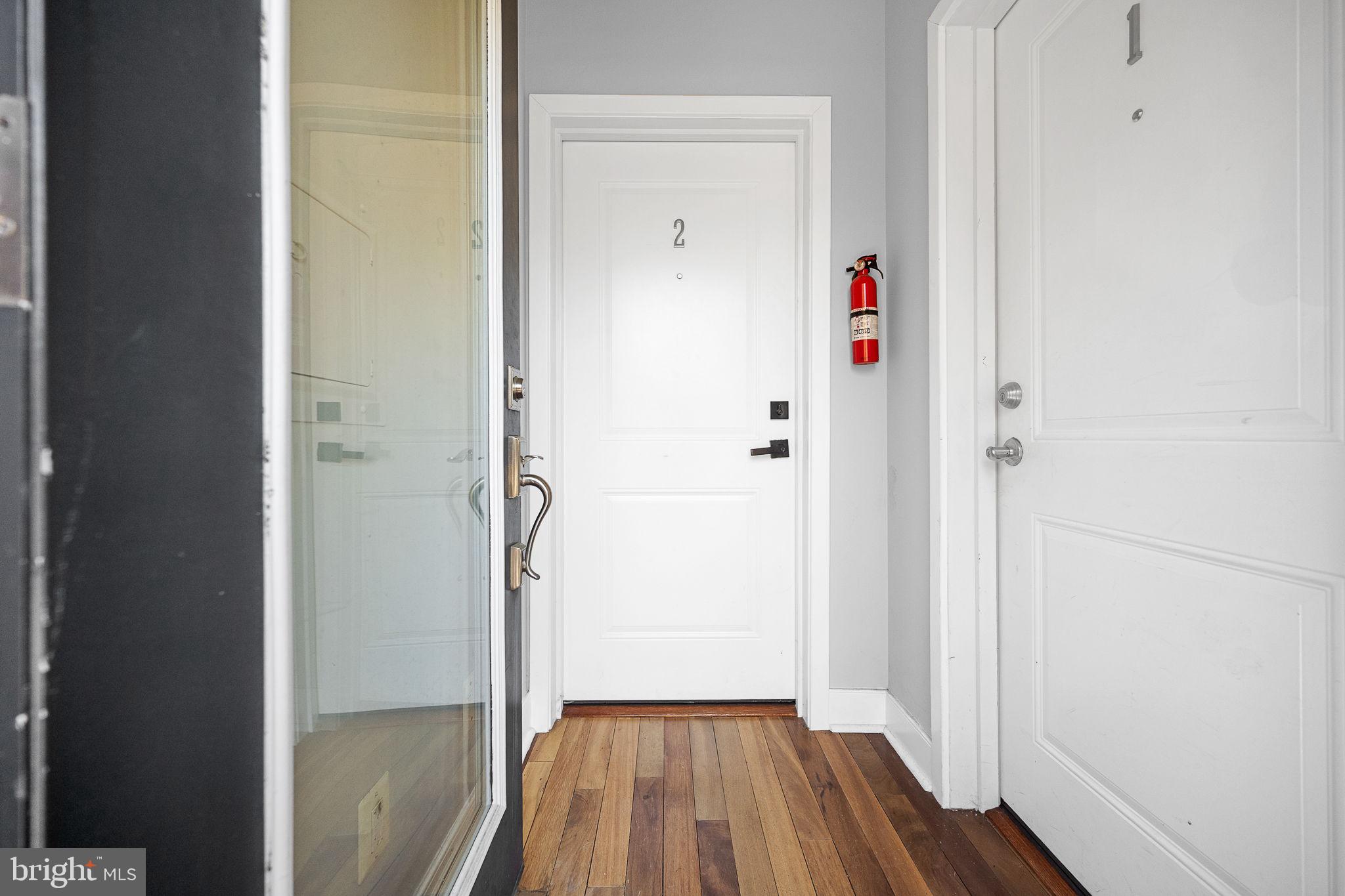 2819 11th Street Northwest, Unit 2 Washington, DC 20001 - Photo 3 of 36 a view of a hallway with wooden floor and closet