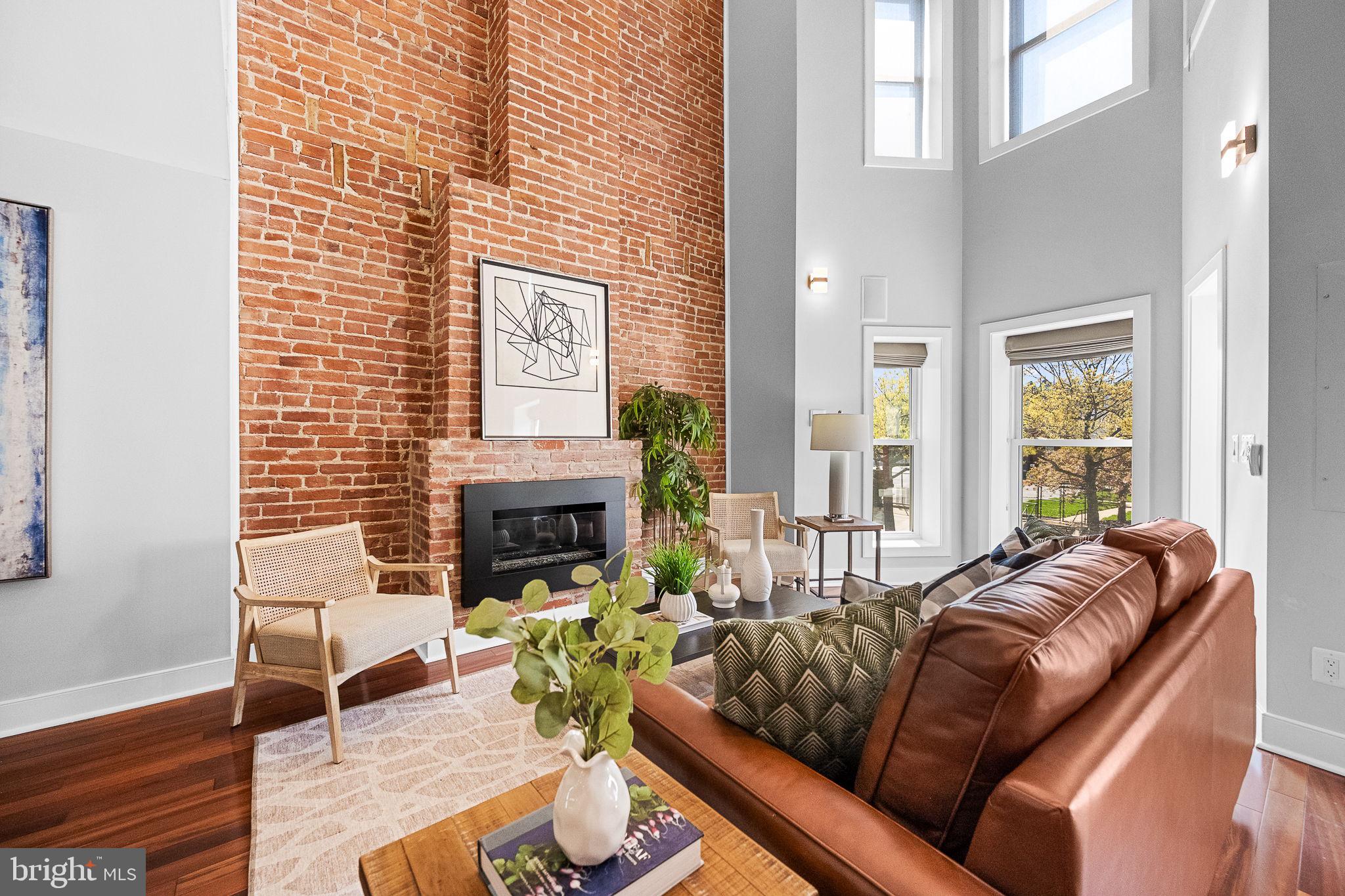 2819 11th Street Northwest, Unit 2 Washington, DC 20001 - Photo 5 of 36 a living room with furniture and a fireplace