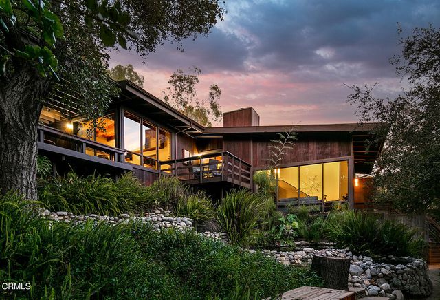 a view of a house with a garden