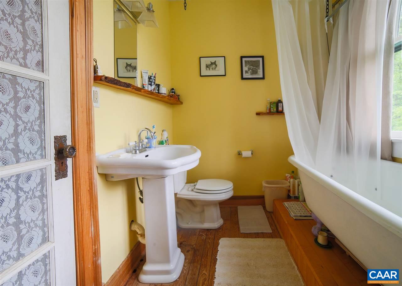 1139 Spencer Road Dillwyn, VA 23936 - Photo 12 of 29 a bathroom with a sink toilet and shower