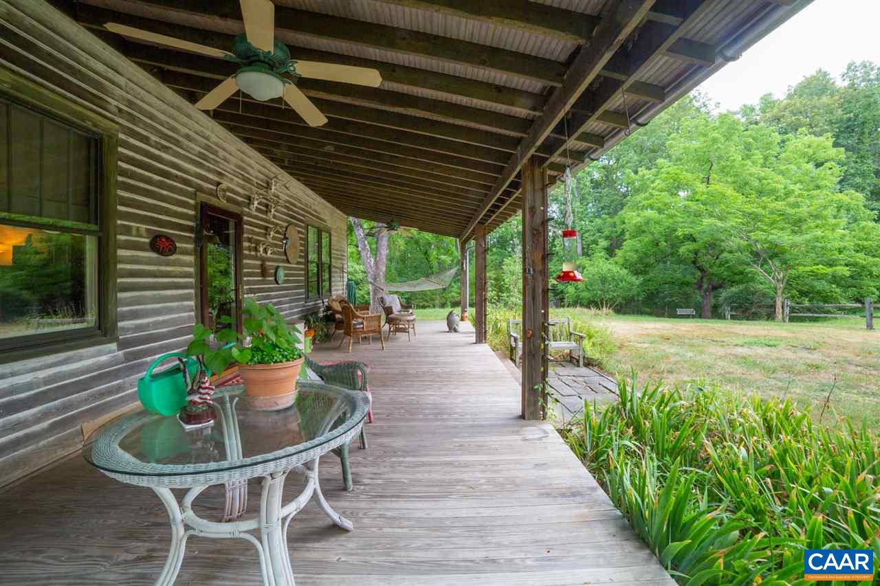 1139 Spencer Road Dillwyn, VA 23936 - Photo 17 of 29 a view of a patio with a table chairs and a backyard