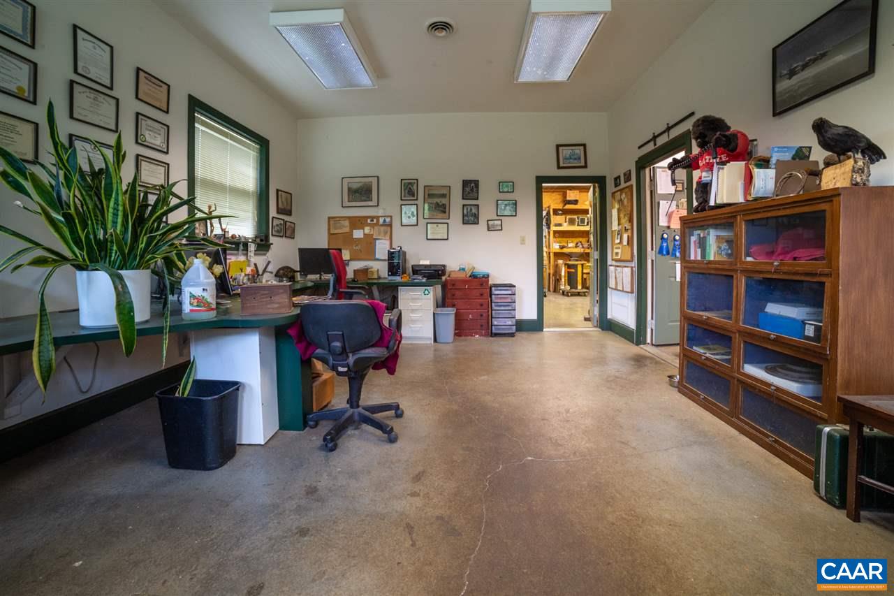 1139 Spencer Road Dillwyn, VA 23936 - Photo 25 of 29 a view of a workspace with furniture and a potted plant