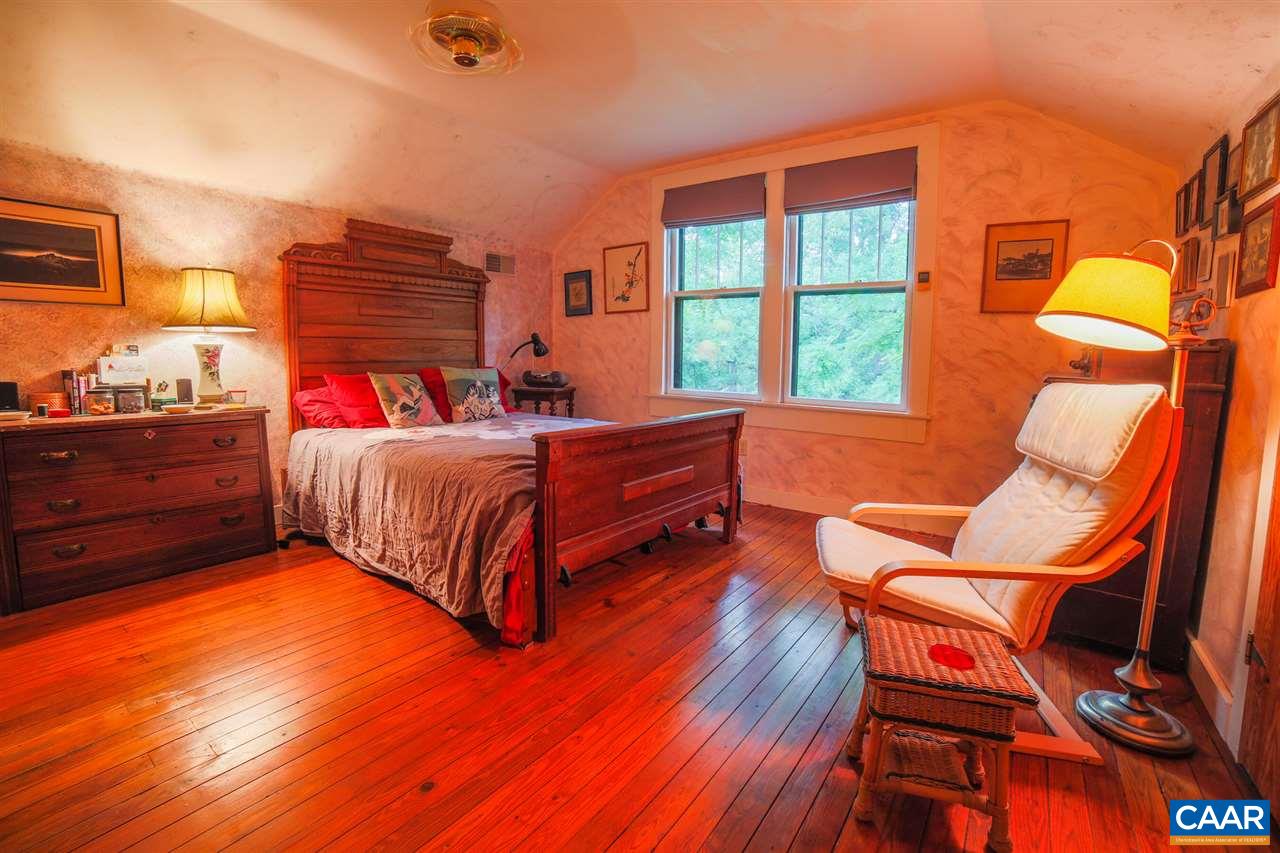 1139 Spencer Road Dillwyn, VA 23936 - Photo 4 of 29 a bedroom with a bed and wooden floor