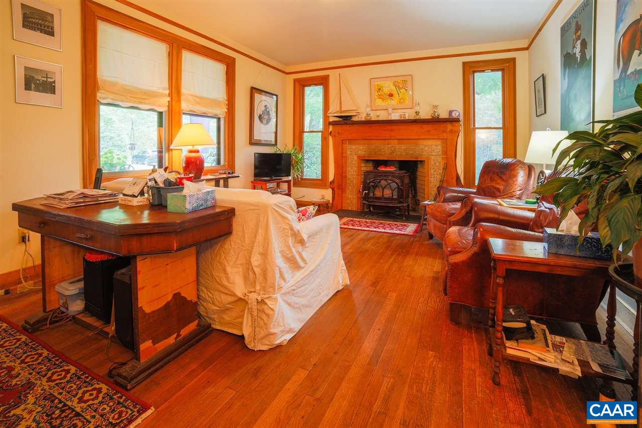 1139 Spencer Road Dillwyn, VA 23936 - Photo 10 of 29 a living room with furniture a fireplace and a floor to ceiling window