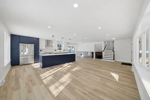 a bathroom with shower bathtub and mirror
