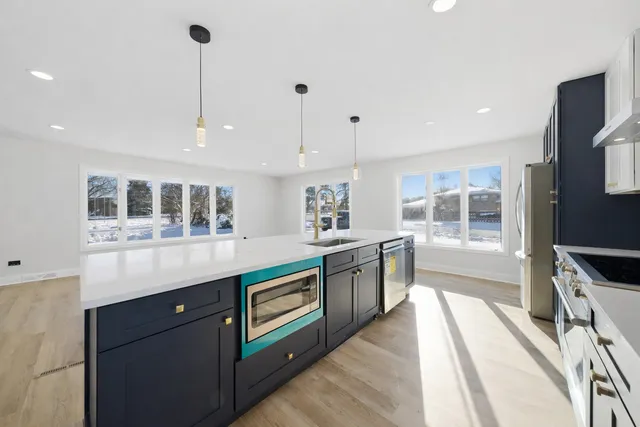 a view of a room with wooden floor and white walls