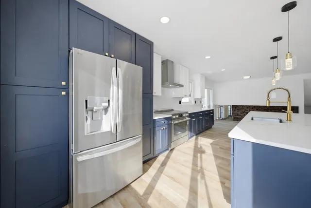 a bathroom with a sink a mirror and a vanity