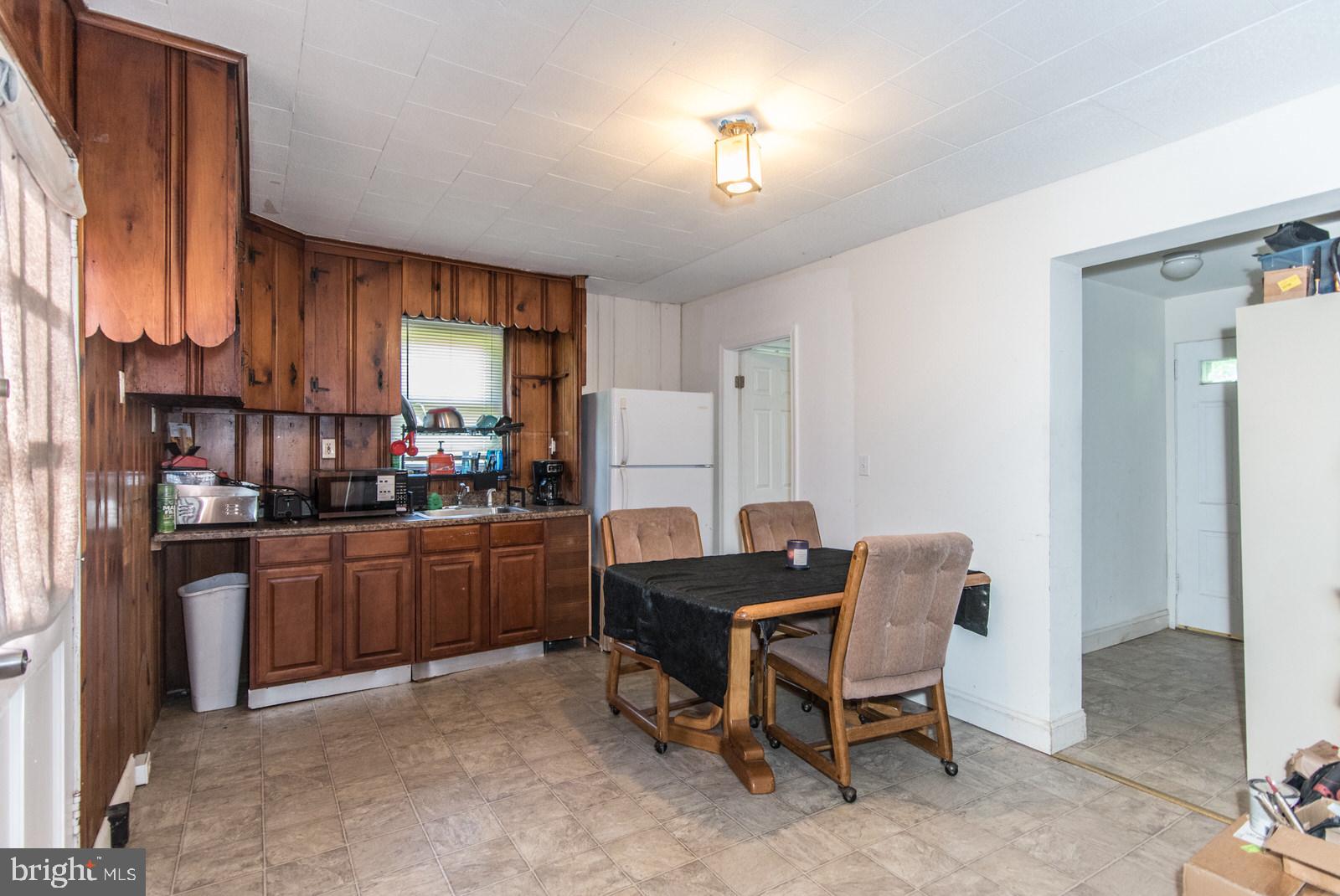 169 State Rd. Bensalem, PA 19020 - Photo 50 of 100 a kitchen with cabinets and chairs