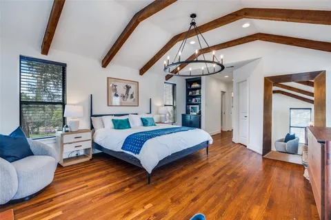 a bedroom with a bed and a couch