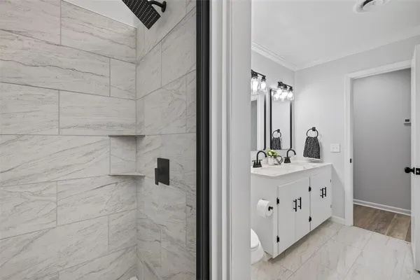 a bathroom with a double vanity sink and mirror