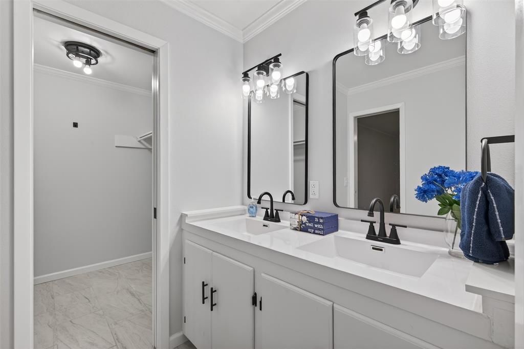 522 Lee Street Mansfield, LA 71052 - Photo 17 of 20 a bathroom with a double vanity sink and a mirror