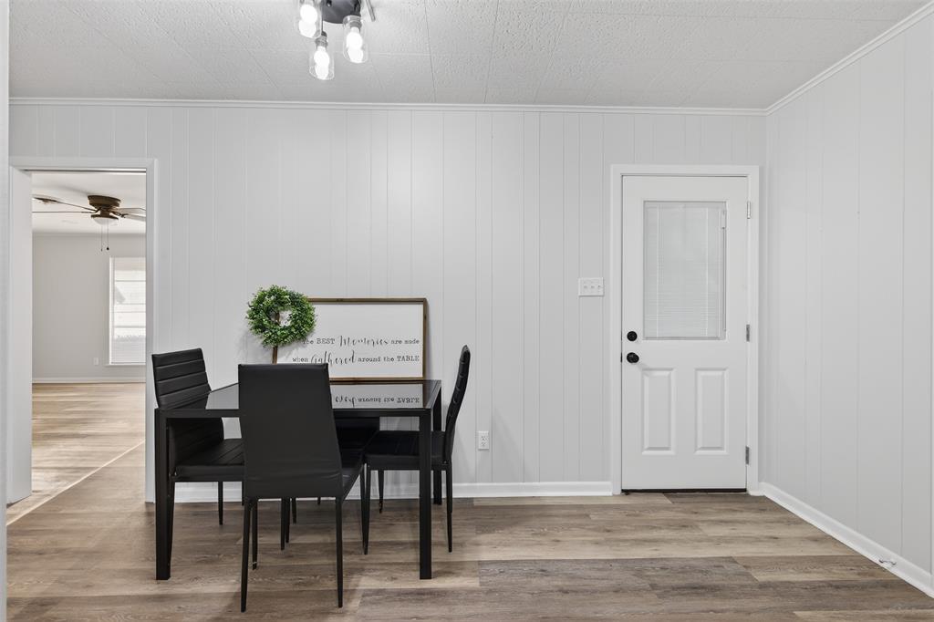 522 Lee Street Mansfield, LA 71052 - Photo 7 of 20 a view of a dining room with furniture and wooden floor