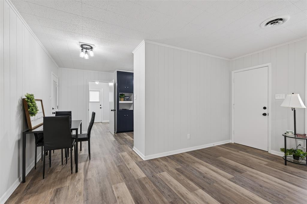 522 Lee Street Mansfield, LA 71052 - Photo 8 of 20 a view of a dining room with furniture and wooden floor