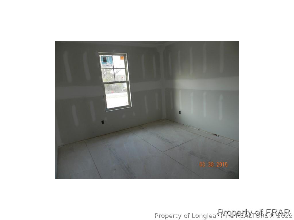 2848 Rockfish Road Raeford, NC 28376 - Photo 8 of 9 a view of an empty room with a window