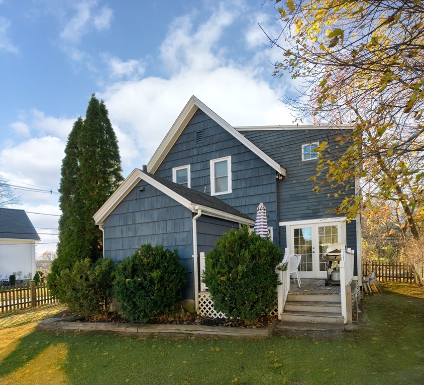 31 Marion Street Natick, MA 01760 - Photo 14 of 32 a front view of a house with a yard