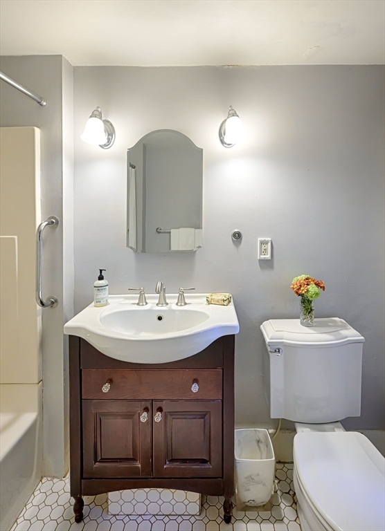 31 Marion Street Natick, MA 01760 - Photo 20 of 32 a bathroom with a sink toilet and mirror