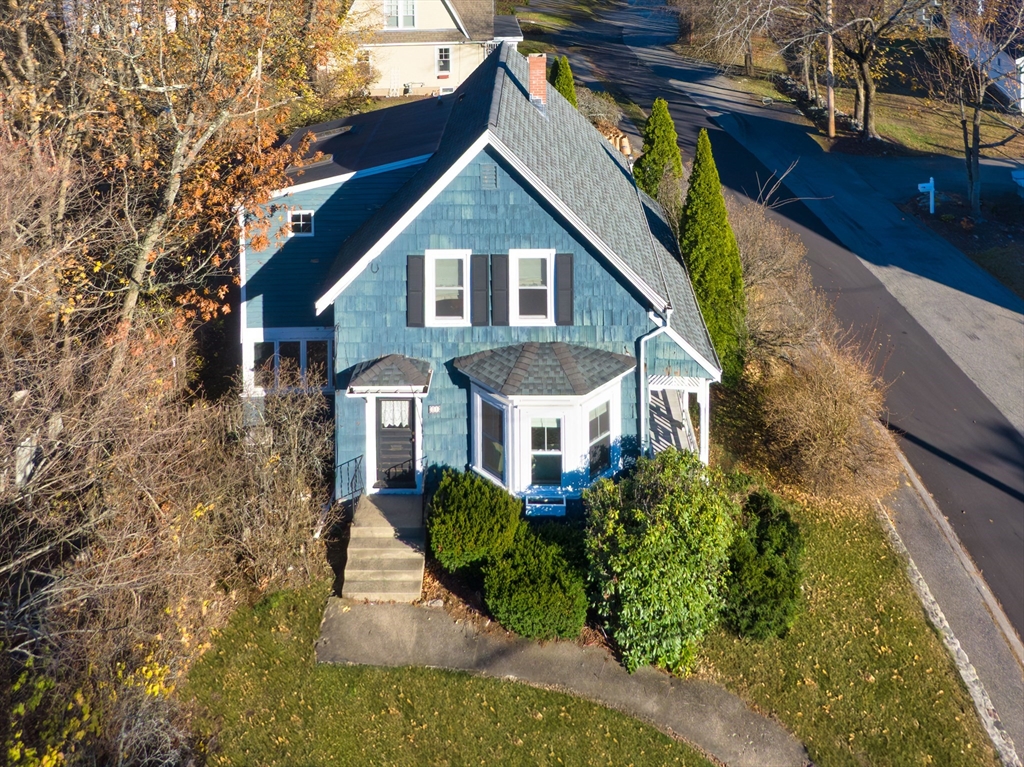 31 Marion Street Natick, MA 01760 - Photo 2 of 32 a front view of a house with a yard and potted plants