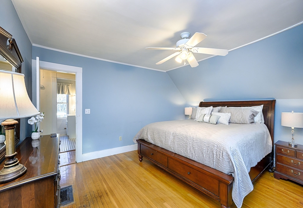 31 Marion Street Natick, MA 01760 - Photo 23 of 32 a bedroom with a bed and a chandelier