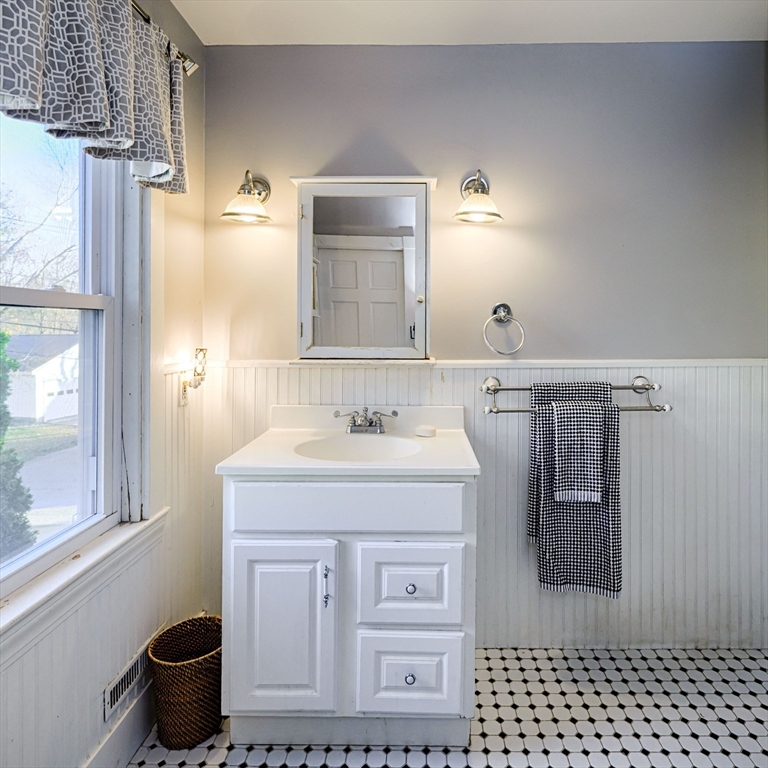 31 Marion Street Natick, MA 01760 - Photo 29 of 32 a bathroom with a sink and a toilet