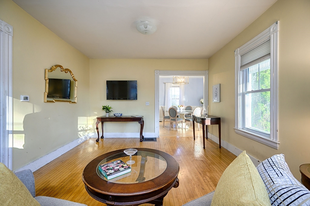 31 Marion Street Natick, MA 01760 - Photo 4 of 32 a living room with furniture and a flat screen tv