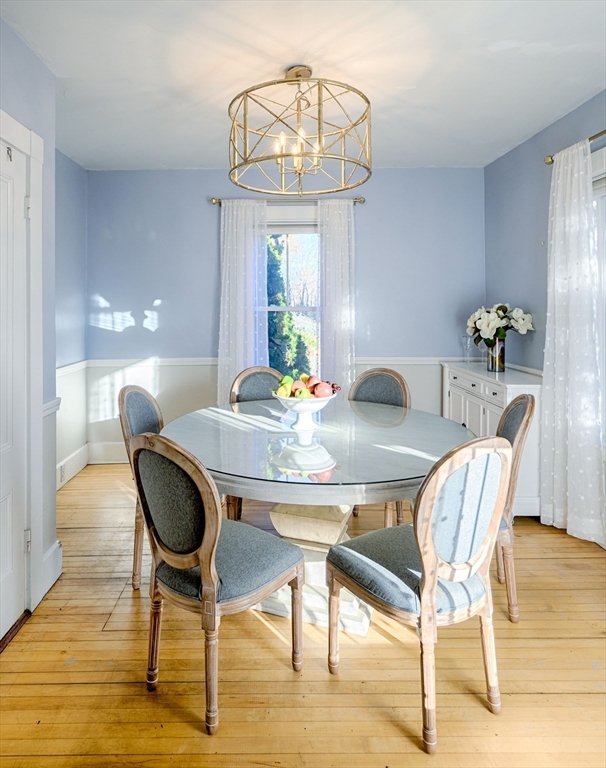 31 Marion Street Natick, MA 01760 - Photo 6 of 32 a view of a dining room with furniture and wooden floor