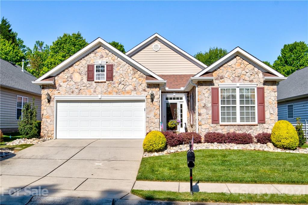 3237 Sapphire Lane Fort Mill, SC 29708 - Photo 1 of 33 a front view of a house with a yard and garage