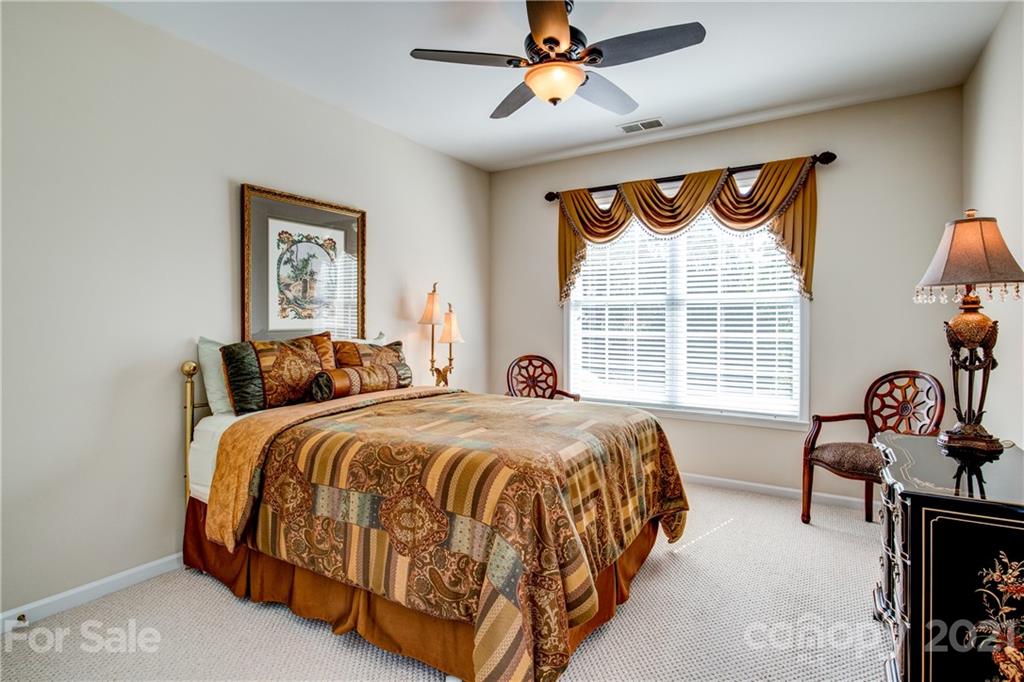 3237 Sapphire Lane Fort Mill, SC 29708 - Photo 5 of 33 a spacious bedroom with a bed and a window