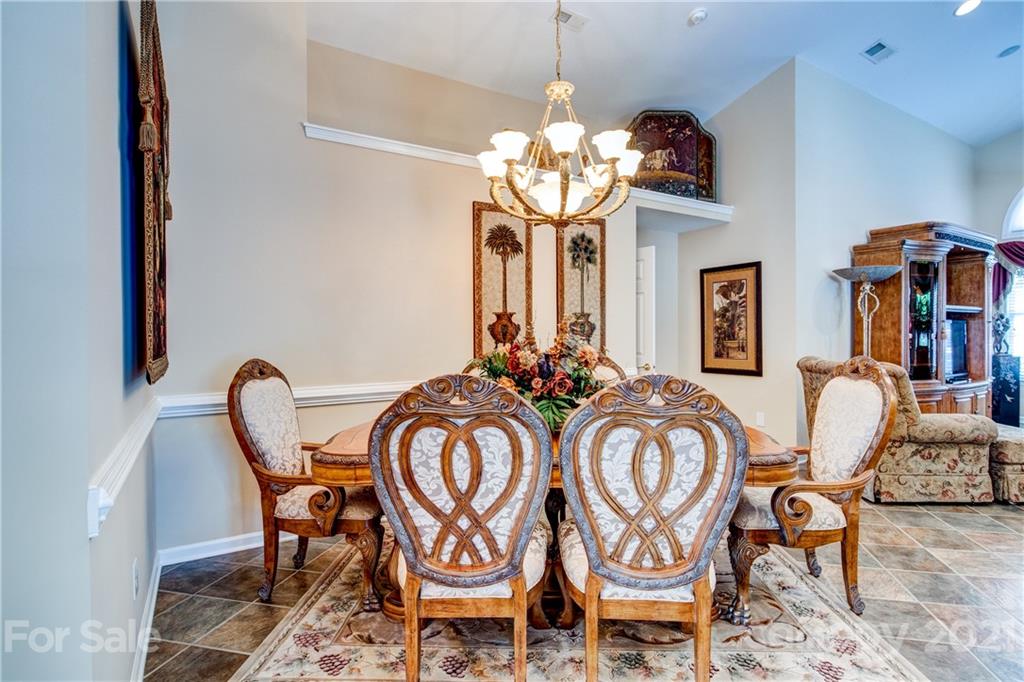 3237 Sapphire Lane Fort Mill, SC 29708 - Photo 8 of 33 a view of a dining room with furniture and chandelier