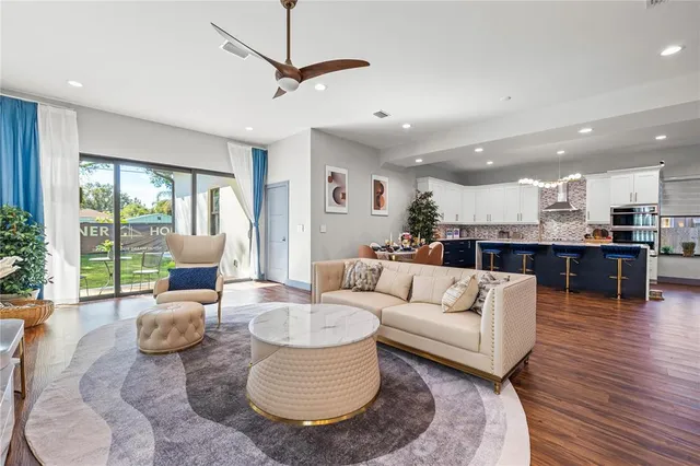 a living room with furniture and a large window