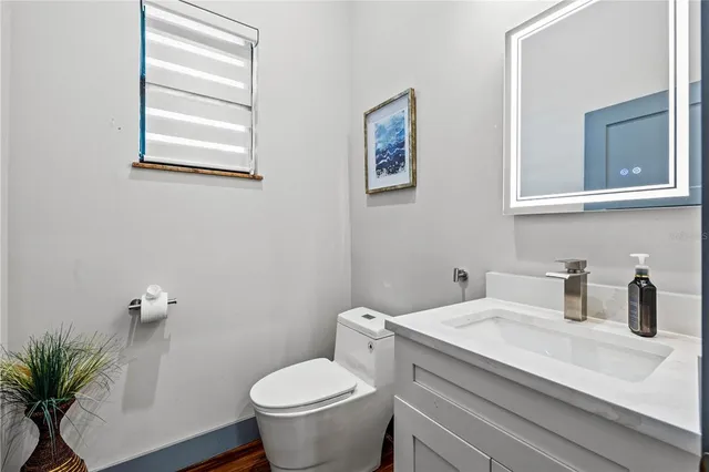 a kitchen with sink and cabinets
