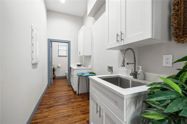 a balcony with furniture and a potted plant