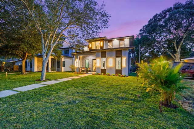 a view of a house with a yard
