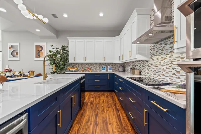 a kitchen with granite countertop a sink and cabinets