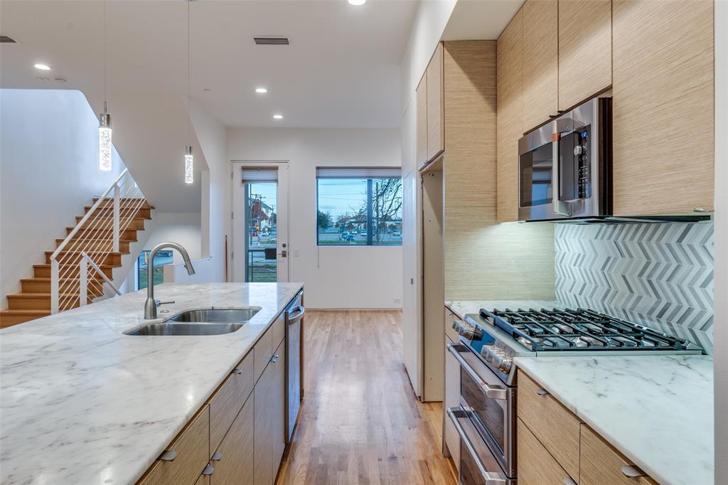 1505 North Haskell Avenue, Unit 3 Dallas, TX 75204 - Photo 14 of 28 a kitchen with a sink stove and refrigerator