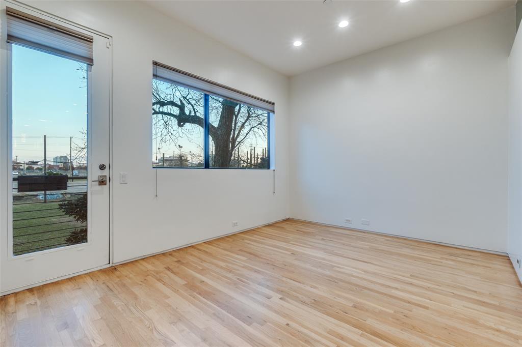 1505 North Haskell Avenue, Unit 3 Dallas, TX 75204 - Photo 16 of 28 an empty room with wooden floor and windows
