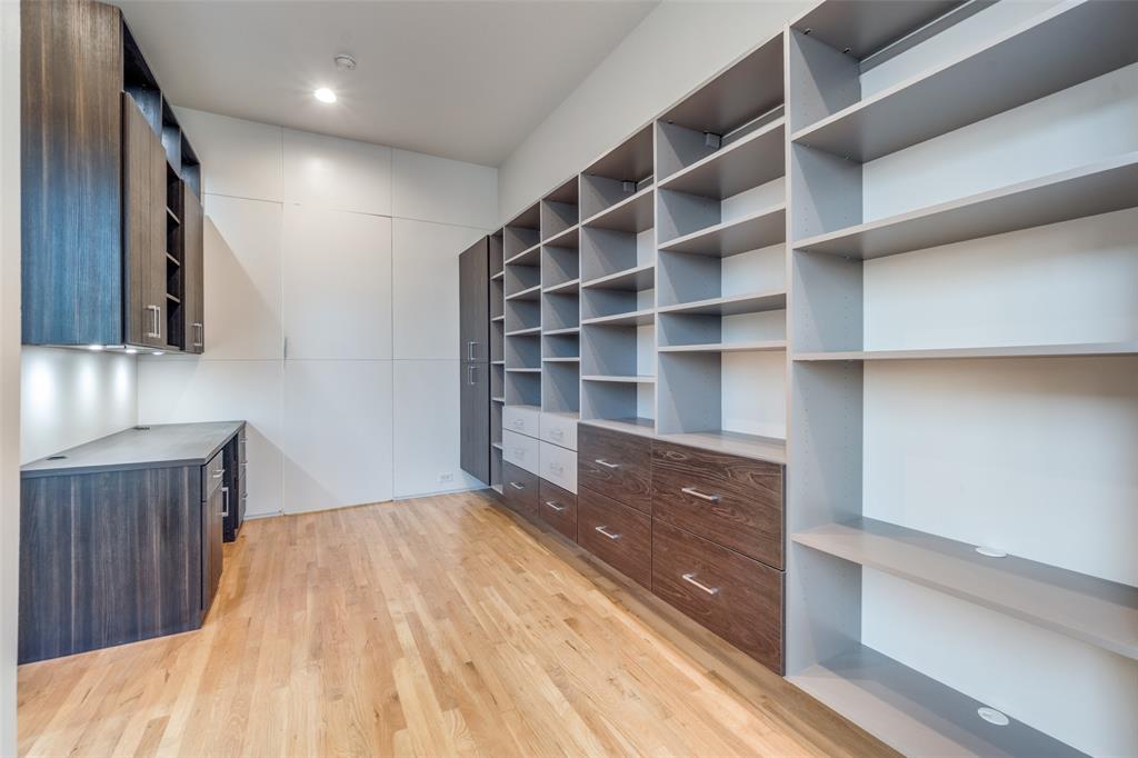 1505 North Haskell Avenue, Unit 3 Dallas, TX 75204 - Photo 17 of 28 a view of an empty room with wooden floor and cabinet