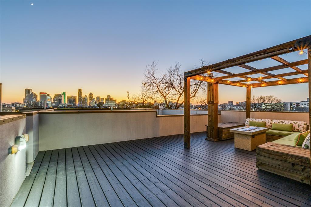 1505 North Haskell Avenue, Unit 3 Dallas, TX 75204 - Photo 27 of 28 a view of a balcony with chairs and wooden floor