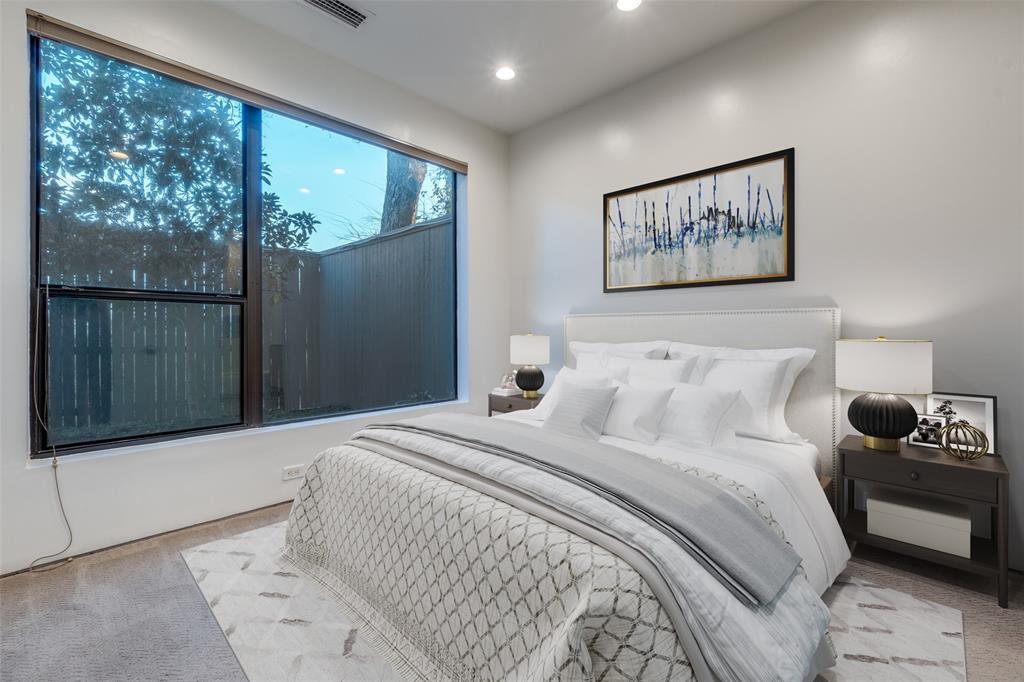 1505 North Haskell Avenue, Unit 3 Dallas, TX 75204 - Photo 4 of 28 a bedroom with a large bed and a window