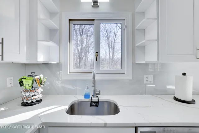 a kitchen with a sink and a window