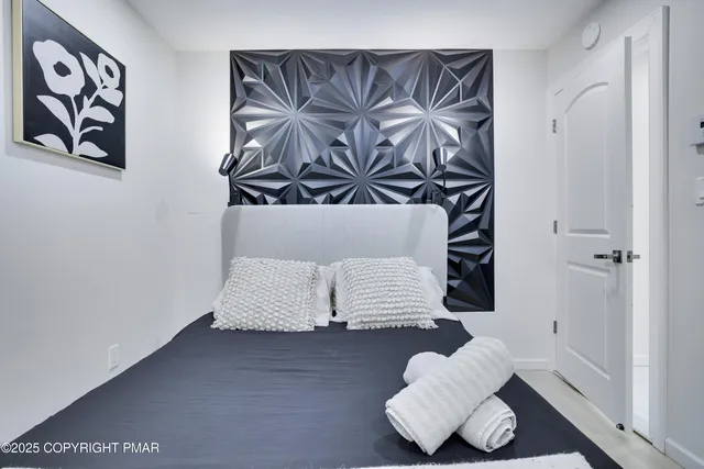 a dining room with furniture and a potted plant