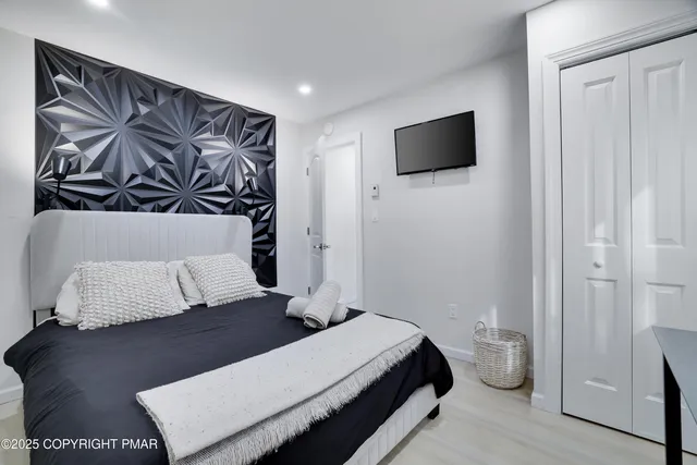 a view of living room with furniture and a fireplace