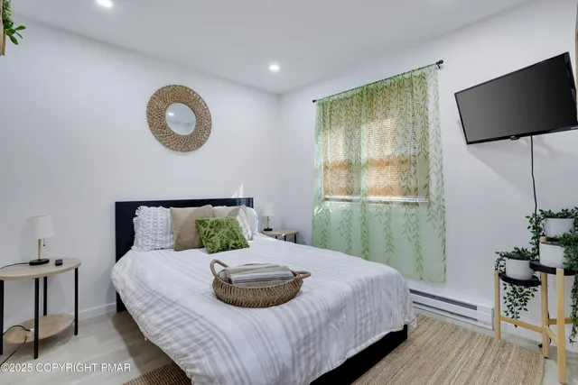 a bedroom with a bed and a window