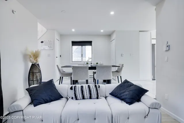 a bedroom with furniture and a painting