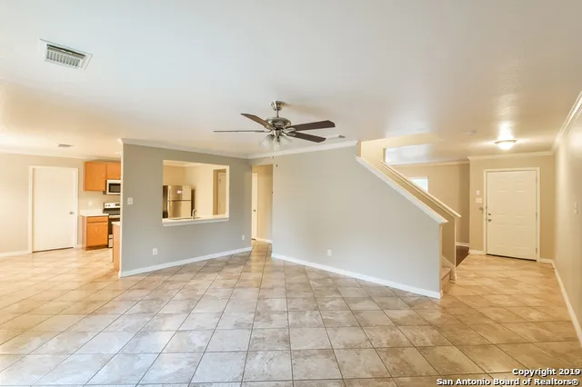 a view of a livingroom with a staircase