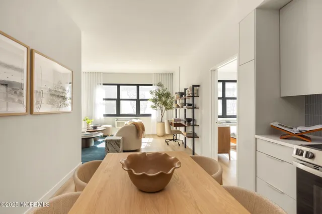 a living room with furniture fireplace and a window