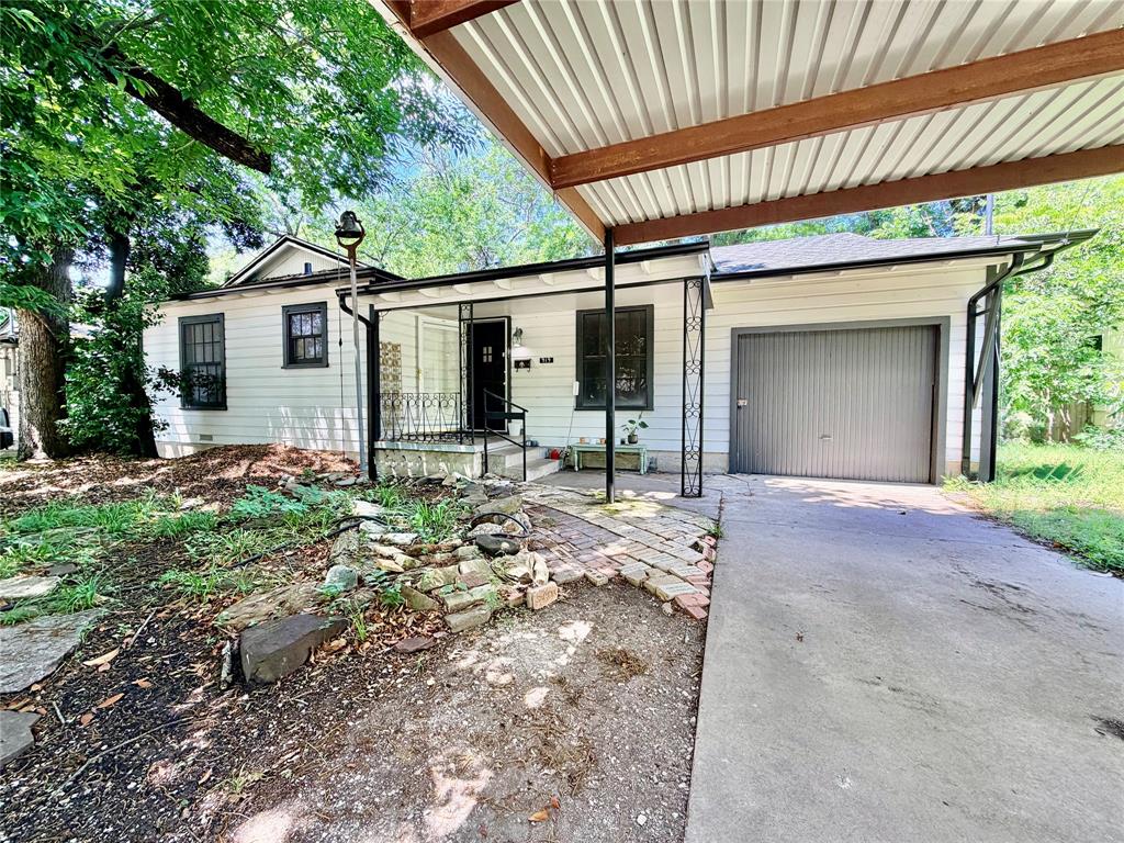 919 Denton Street Denton, TX 76201 - Photo 2 of 19 a backyard of a house with yard and outdoor seating