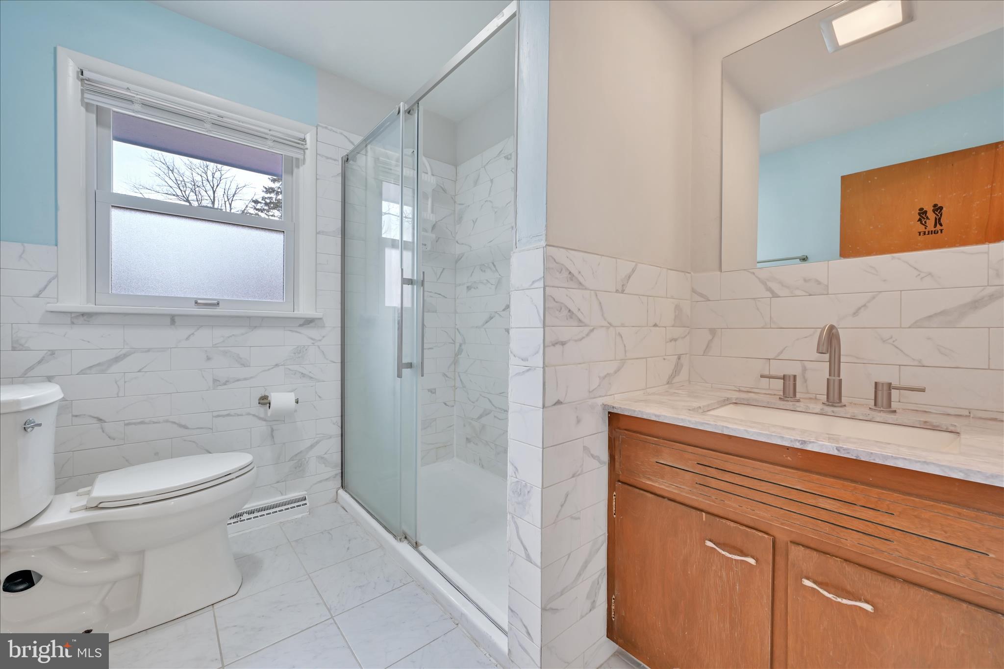 1137 Nissley Road Lancaster, PA 17601 - Photo 17 of 33 a bathroom with a sink a toilet and shower