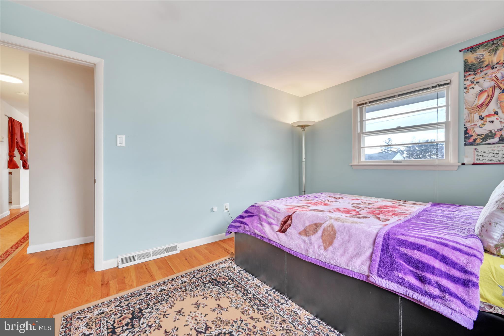 1137 Nissley Road Lancaster, PA 17601 - Photo 18 of 33 a bedroom with a bed and a window with wooden floor