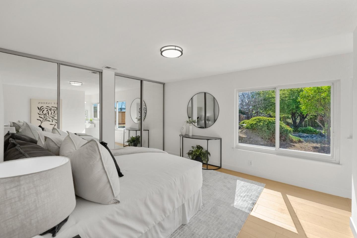 4624 Fuller Street Santa Clara, CA 95054 - Photo 15 of 26 a spacious bedroom with a bed a mirror and a large window